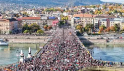 epa12475133 In this picture taken by a drone, participants of the Peace March organized by the pro-government Civil Unity Forum (COF) and its foundation Civil Unity Public Benefit Foundation (COKA) walk on the Margaret Bridge in Budapest, Hungary, 23 October 2025, on the 69th anniversary of the Hungarian revolution and war of independence against communist rule and the Soviet Union in 1956. EPA/ZSOLT CZEGLEDI HUNGARY OUT