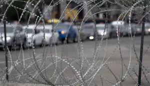 epa07178566 A line of cars waiting to enter the San Ysidro Port of Entry border crossing are pictured through concertina wire, in San Diego, California, USA, 19 November 2018. The US military has been assisting Customs and Border Protection to install concertina wire and other measures to secure the border crossing and the US-Mexico border wall. Asylum seekers frequently cross the US-Mexico border or enter the ports of entry to present themselves to US immigration to seek asylum. EPA/DAVID MAUNG