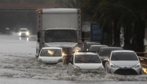 epa12477319 Vehicles drive down a flooded street in Santo Domingo, Dominican Republic, 23 October 2025. More than 647,000 users are without drinking water in the Dominican Republic after rains from Tropical Storm Melissa affected dozens of aqueducts, according to official data. EPA/Orlando Barria