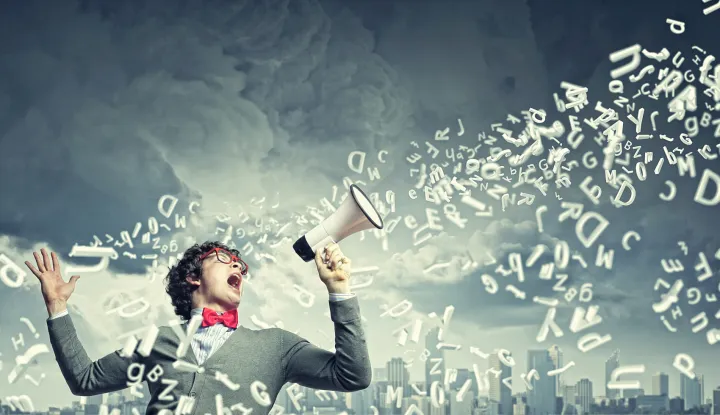 young man with megaphone dreamstime_xxl_33386929 - Job CrusherJob Crusher