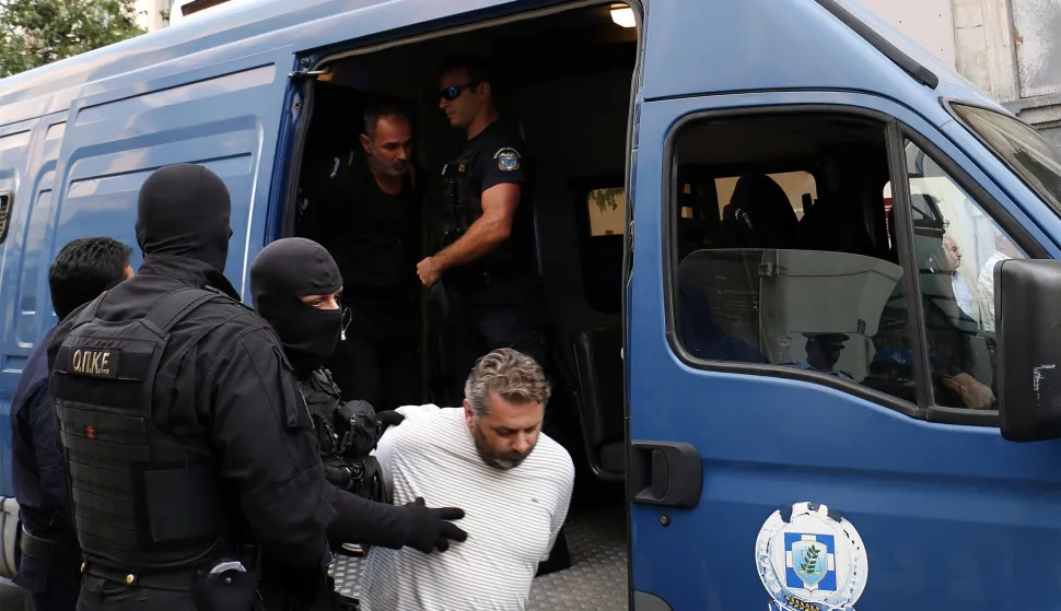 epa06242825 The kidnappers of abducted greek businessman Michalis Lebidakis are driven by the police to the court in city of Heraklion in Crete island, in Greece, 03 October 2017. Lebidakis, aged 53, was rescued by police on 02 October from a captivity that had lasted six months, following his abduction in the Heraklion area. He was found after a police raid on an abandoned used car scrap yard about five kilometres outside of the city of Rethymno. EPA/KOSTAS CHALKIADAKIS