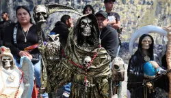 epa12496460 Images of Santa Muerte at the shrine on Alfareria Street in Mexico City, Mexico, 31 October 2025. EPA/MARIO GUZMAN