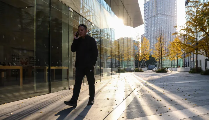 epa12500165 A man walks in Beijing's Central Business District, China, 03 November 2025. EPA/WU HAO