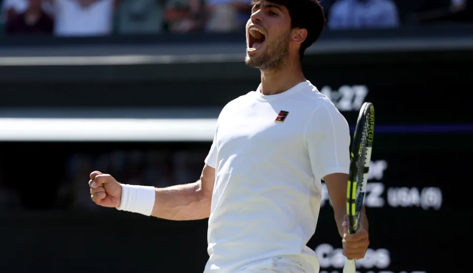 epa12232121 Carlos Alcaraz of Spain celebrates wining the Men's Singles semi-finals match against Taylor Fritz of the USA at the Wimbledon Championships, Wimbledon, Britain, 11 July 2025. EPA/NEIL HALL EDITORIAL USE ONLY