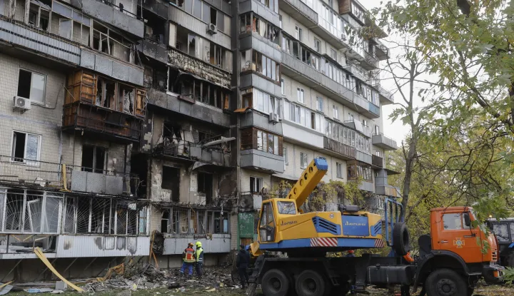 epa12483395 Ukrainian rescuers work at the site of a Russian strike in Kyiv, Ukraine, 26 October 2025, amid the Russian invasion. At least three people were killed and more than 30 others injured, including seven children, after Russian forces launched an overnight attack on Kyiv, the National Police of Ukraine reported. EPA/SERGEY DOLZHENKO
