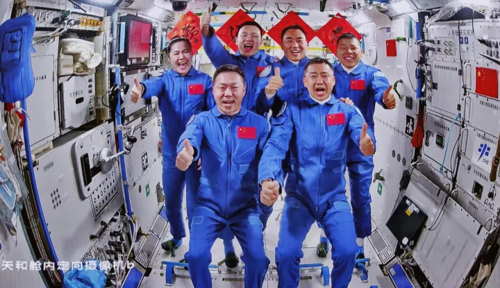 epa12053240 An image captured at the Beijing Aerospace Control Center shows a group photo of the crew of Shenzhou-19 and Shenzhou-20 manned spaceships on the Tiangong Space Station, 25 April 2025. The three astronauts aboard Shenzhou-20 entered the Chinese space station early 25 April and were welcomed by the Shenzhou-19 crew, marking the sixth in-orbit crew handover in China's spaceflight history, according to the China Manned Space Agency (CMSA). The Shenzhou-19 crew is expected to return to the Dongfeng landing site in Inner Mongolia on 29 April. EPA/XINHUA/Jin Liwang CHINA OUT/UK AND IRELAND OUT/  MANDATORY CREDIT EDITORIAL USE ONLY