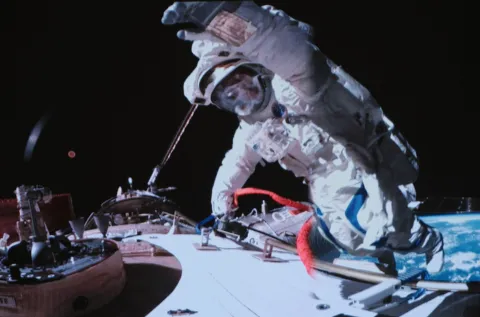 epa11783286 A screen image captured at the Beijing Aerospace Control Center shows Shenzhou-19 astronaut Song Lingdong waving his hand during extravehicular activities outside China's orbiting space station on 17 Secember 2024 (issued 18 December 2024. Shenzhou-19 crew members aboard China's orbiting space station successfully completed a nine-hour spacewalk at 9:57 p.m. Beijing Time on 17 December, according to the China Manned Space Agency (CMSA). EPA/XINHUA/LI JIE CHINA OUT/UK AND IRELAND OUT/  MANDATORY CREDIT EDITORIAL USE ONLY