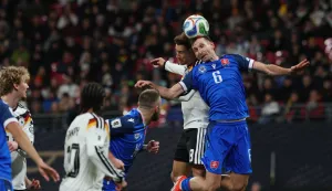 epa12532296 Leon Goretzka of Germany (L) in action against Norbert Gyomber of Slovakia(R) during the FIFA World Cup 26 UEFA qualifier between Germany and Slovakia in Leipzig, Germany, 17 November 2025. EPA/FILIP SINGER