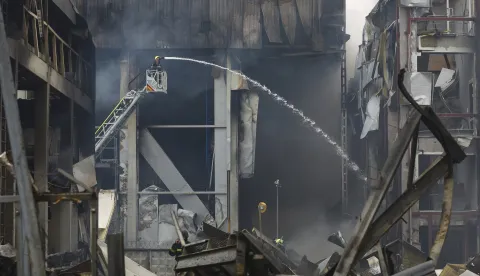 epa12480956 Ukrainian rescuers work at the site of a Russian missile strike in Kyiv, Ukraine, 25 October 2025, amid the Russian invasion. At least two people were killed and 13 others injured after Russian forces launched an overnight attack on Kyiv, the State Emergency Service of Ukraine reported. EPA/SERGEY DOLZHENKO