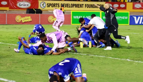 Soccer Football - FIFA World Cup - CONCACAF Qualifiers - Group B - Jamaica v Curacao - National Stadium Independence Park, Kingston, Jamaica - November 18, 2025 Curacao coach Dean Gorre and players celebrate after they qualify for the World Cup REUTERS/Gilbert Bellamy Photo: GILBERT BELLAMY/REUTERS
