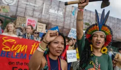 epa12535958 People demonstrate during a protest against fossil fuels, calling for the rights of indigenous communities to be respected at the entrance to the Blue Zone of COP30 in Belem, Brazil, 19 November 2025. EPA/FRAGA ALVES