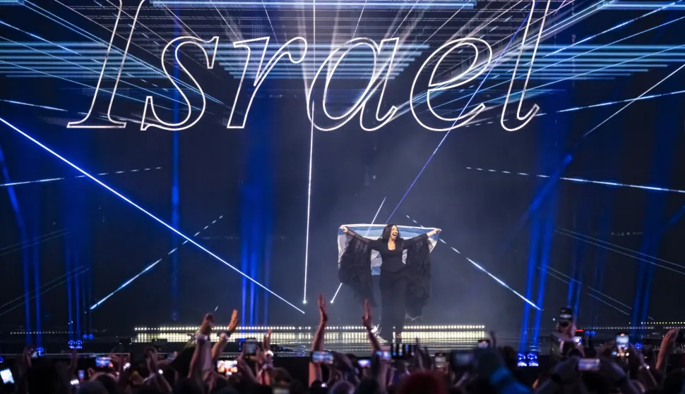 epa12111126 Israel's Yuval Raphael takes part in the flag parade during the final at the 69th Eurovision Song Contest in Basel, Switzerland, 17 May 2025. EPA/GEORGIOS KEFALAS