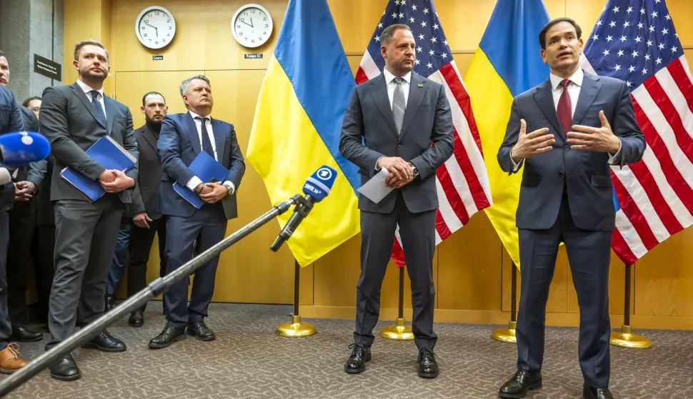 epa12544576 Head of the Office of the President of Ukraine Andriy Yermak (C), and US Secretary of State Marco Rubio (R), talk to the press as their consultations continue on the Trump peace plan at the US Mission in Geneva, Switzerland, 23 November 2025. US and Ukraine officials are expected to meet in Geneva on 23 November to discuss the US president's peace plan aimed at ending the war with Russia. EPA/MARTIAL TREZZINI