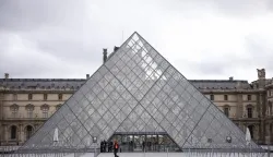 epa12466947 An exterior view of the Louvre Museum a day after a robbery in Paris, France, 20 October 2025. The Louvre Museum was targeted in a robbery by several criminals who smashed windows to steal eight priceless royal pieces of jewelry on 19 October. The Louvre remains closed for a second day running. French Culture Minister Rachida Dati called it 'an attack on France's cultural heritage.' EPA/YOAN VALAT