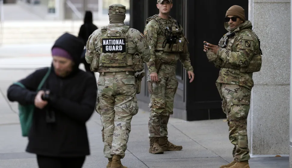epa12555569 National Guard members stand close to the scene, where two National Guard members were shot in Washington, DC USA, 28 November 2025. US President Trump announced on 27 November that National Guard member Sarah Beckstrom died of her injuries following a shooting in Washington on 26 November, another National Guard member Andrew Wolfe remains in hospital. EPA/WILL OLIVER