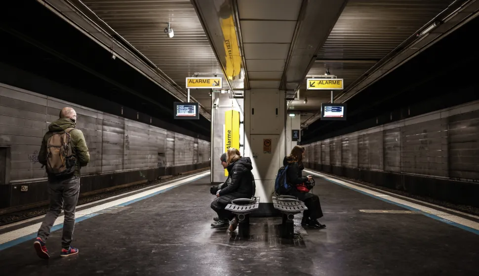 epa12564050 Commuters stand on a regional train platform during French National Railways strike in Paris, France, 02 December 2025. French unions called for a nationwide, cross-sector strike to protest against the government's budget proposal for 2026. EPA/YOAN VALAT