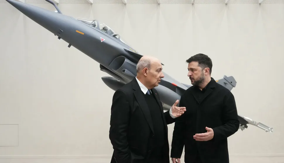 epa12562856 CEO of French aircraft manufacturer Dassault Aviation Eric Trappier (L) greets Ukrainian President Volodymyr Zelensky at the Dassault Aviation plant in Cergy, northwest of Paris, France, 01 December 2025. Zelensky is in France for talks with French President Emmanuel Macron on the situation in Ukraine. EPA/DIMITAR DILKOFF/POOL MAXPPP OUT
