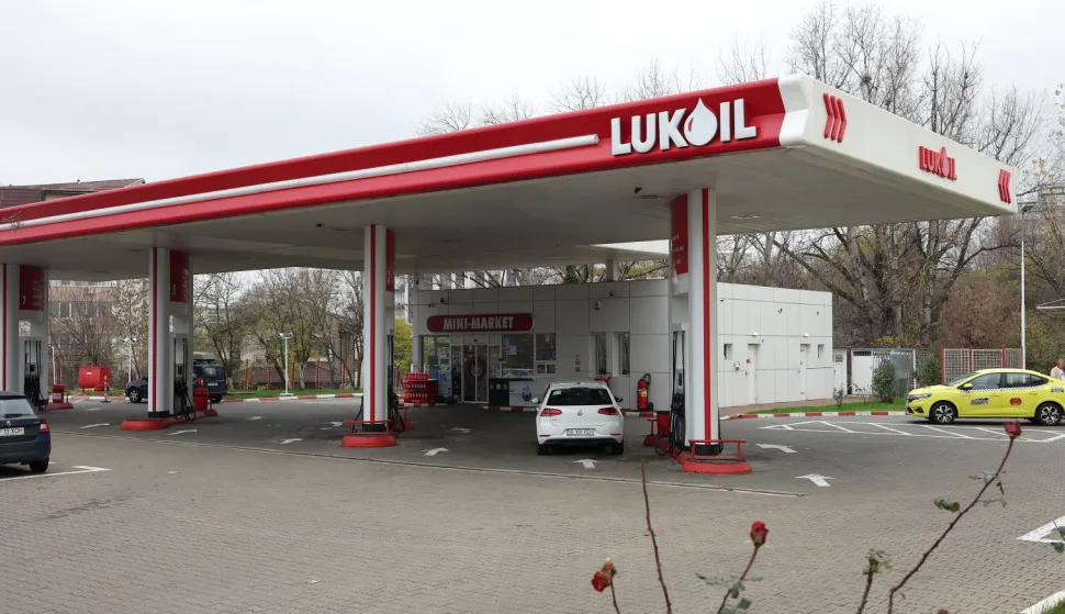epa12566927 Cars refuel at a Lukoil gas station in Bucharest, Romania, 03 December 2025. The Romanian government approved on 02 December a mechanism for state intervention in companies affected by US sanctions. The measure is directly related to the Lukoil situation, given that US sanctions against the Russian oil giant entered into force on November 21 for the Lukoil refinery, and will apply from December 13 for gas stations on Romanian soil. Lukoil owns the Petrotel-Lukoil refinery in Romania, a network of 310 gas stations and has approximately 3,000 employees. EPA/ROBERT GHEMENT