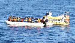 epa05515135 A handout photograph released on 30 August 2016 by the Italian Navy showing migrants on a boat during rescue operations in the Mediterranean Sea, off the Libyan coast. Italian Navy ships Fasan, Sfinge, and Cigala Fulgosi rescued on 29 August almost 2500 migrants. Over 6000 migrants, mostly from Eritrea and Somalia, were rescued off the coast of Libya in the Mediterranean Sea. The joint operation involved several Italian and International agencies. EPA/MARINA MILITARE/HANDOUT HANDOUT EDITORIAL USE ONLY/NO SALES/NO ARCHIVES