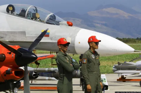 Soldiers stand next to military planes during the Expo Aeronautica Venezuela 2025, after U.S. President Donald Trump said on Saturday the airspace above and surrounding Venezuela should be considered "closed in its entirety," without giving further details, as his administration ramps up pressure on President Nicolas Maduro's government, in Maracay, Venezuela November 29, 2025. REUTERS/Juan Carlos Hernandez Photo: Juan Carlos Hernandez/REUTERS