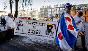 epa07078465 Sympathizers of the traditional figure Black Pete outside the court in Leeuwarden, Netherlands, 08 October 2018. Some 34 people suspected of blocking a road on the day of the national Sinterklaas race in 2017, had to appear in court. Black Pete or Zwarte Piet is the companion of Saint Nicolas during the Sinterklaas (Saint Nicolas) festival celebrated on the evening of 05 December, and has become the subject of much controversy in recent years as some people think it is racist. EPA/ROBIN OF LONKHUIJSEN