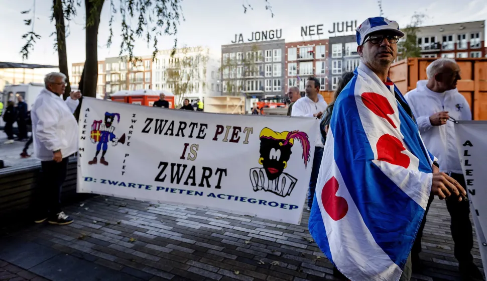epa07078465 Sympathizers of the traditional figure Black Pete outside the court in Leeuwarden, Netherlands, 08 October 2018. Some 34 people suspected of blocking a road on the day of the national Sinterklaas race in 2017, had to appear in court. Black Pete or Zwarte Piet is the companion of Saint Nicolas during the Sinterklaas (Saint Nicolas) festival celebrated on the evening of 05 December, and has become the subject of much controversy in recent years as some people think it is racist. EPA/ROBIN OF LONKHUIJSEN