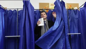 epa12576412 Romanian President Nicusor Dan exits the voting booth after casting his ballot for the capital's mayoral elections at a polling station in Bucharest, Romania, 07 December 2025. The Romanian capital, Bucharest, holds its early mayoral elections on 07 December, following Nicusor Dan's ascent from mayor to President of Romania earlier this year. EPA/ROBERT GHEMENT