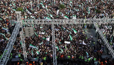 epa12572448 A general view shows hundreds of people gathered in Al-Assi Square during celebrations marking one year since the city's liberation, in Hama, Syria, 05&nbsp;December&nbsp;2025. Syria marks the first anniversary of the sudden collapse of Bashar al-Assad's regime on 08 December 2025, bringing to an end more than five decades of Baathist rule. According to the UN Human Rights Office, the civil war in Syria claimed more than 300.000 civilians' lives from March 2011 to March 2021. Millions of Syrians remain displaced inside the country and as refugees abroad. EPA/BILAL AL-HAMMOUD