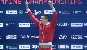 epa12577598 Gold medalist Jere Hribar of Croatia celebrates during the medal ceremony for the Men's 50m Freestyle Final during the European Short Course Swimming Championships at the Aqua Lublin, in Lublin, Poland, 07 December 2025. EPA/Wojtek Jargilo POLAND OUT