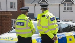 epa06865099 Police officers stand outside the house where Dawn S. and Charlie R. were found unconscious on Saturday night, in Amesbury, Britain, 05 July 2018. Charlie R. and his partner Dawn S. had allegedly being exposed to the nerve agent Novichok. EPA/RICK FINDLER