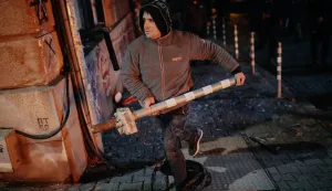 epa12563313 A protester carries a pole during a rally against the 2026 national budget in Sofia, Bulgaria, 01 December 2025. The demonstration was organized by opposition parties to challenge the government's proposed financial plan. EPA/BORISLAV TROSHEV