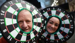 epa12587244 Fans dress in costume as they attend the World Darts Championships at Alexandra Palace in London London, Britain, 12 December 2025. The sporting event runs from 11 December 2025 to 03 January 2026. EPA/NEIL HALL