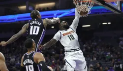 epaselect epa12586678 Denver Nuggets guard Tim Hardaway Jr. (R) dunks the ball for two points past Sacramento Kings guard/forward Demar Derozan (L) during the first half of the NBA basketball game between the Denver Nuggets and the Sacramento Kings in Sacramento, California, USA, 11 December 2025. EPA/JOHN G. MABANGLO SHUTTERSTOCK OUT