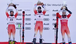epa12589339 (from L) Second placed Luca Aerni of Switzerland, winner Loic Meillard of Switzerland and third placed Marco Odermatt of Switzerland celebrate during the podium ceremony for the Men's Giant Slalom race at the FIS Alpine Skiing World Cup in Val d'Isere, France, 13 December 2025. EPA/SEBASTIEN NOGIER