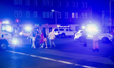 epa12591127 Police and emergency services work near the scene following a shooting incident at Bondi Beach, in Sydney, New South Wales (NSW), Australia, 14 December 2025. NSW Police confirmed at least ten deaths, including one alleged shooter, following the incident at Bondi Beach. Eleven others were injured, including two police officers. Authorities said the second alleged shooter remains in critical condition and is in custody. EPA/JEREMY PIPER AUSTRALIA AND NEW ZEALAND OUT