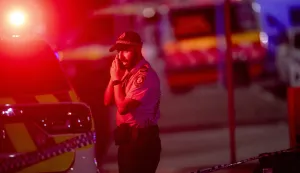 epa12591108 A police officer near the scene following a shooting incident at Bondi Beach, in Sydney, New South Wales (NSW), Australia, 14 December 2025. NSW Police confirmed at least ten deaths, including one alleged shooter, following the incident at Bondi Beach. Eleven others were injured, including two police officers. Authorities said the second alleged shooter remains in critical condition and is in custody. EPA/JEREMY PIPER AUSTRALIA AND NEW ZEALAND OUT