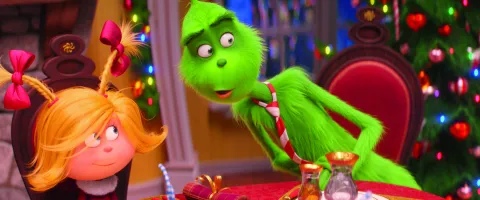 (from left) Cindy-Lou Who (Cameron Seely) helps liberate the Grinch (Benedict Cumberbatch) from his grumpiness in Dr. Seuss' The Grinch from Illumination.