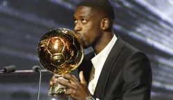 epa12398951 Paris Saint-Germain's player Ousmane Dembele kisses the Men's Ballon d'Or trophy during the Ballon d'Or 2025 ceremony at the Theatre du Chatelet in Paris, France, 22 September 2025. Dembele won the Ballon d'Or 2025. EPA/Mohammed Badra