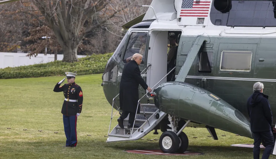 epa12599211 US President Donald J. Trump boards Marine One on the South Lawn of the White House in Washington, DC, USA, 17 December 2025. President Trump is traveling to Dover, Delaware to participate in a Dignified Transfer Ceremony as the remains of US troops return to the US. EPA/SHAWN THEW