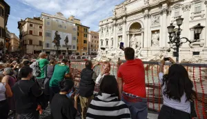 epa11650519 Tourists visit the Fontana di Trevi (Trevi Fountain), as it is cordoned due to the start of maintenance work, in Rome, Italy, 09 October 2024. According to the mayor of Rome, maintenance works, supervised by the Capitoline Superintendency, are expected to last until the end of the year. He also added that Trevi Fountain access would be limited during the Roman Catholic Jubilee Holy Year of 2025 as part of a pilot scheme that may introduce a fee. EPA/FABIO FRUSTACI