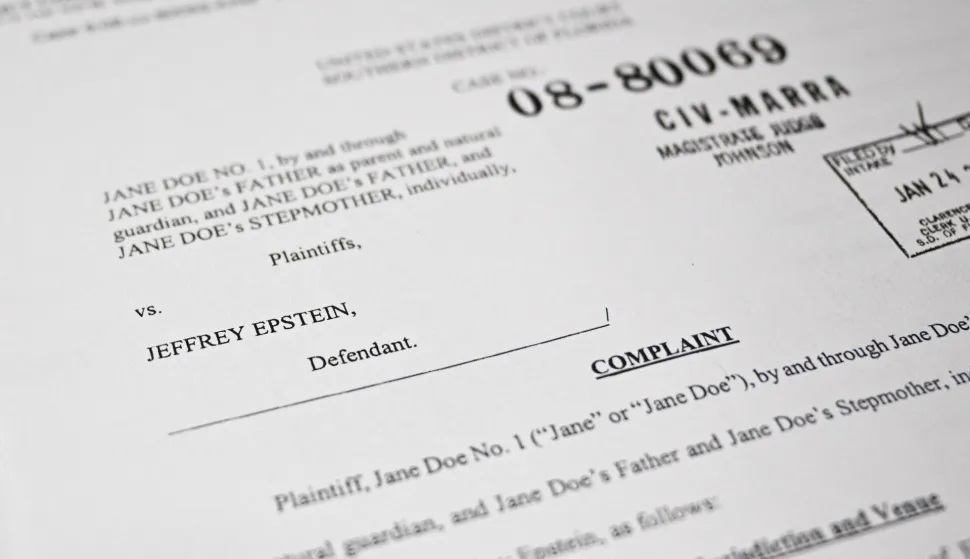 This photo illustration taken in Washington, DC, on December 19, 2025 shows a court document after the US Justice Department began releasing the long-awaited records from the investigation into the politically explosive case of convicted sex offender Jeffrey Epstein. (Photo by Mandel NGAN/AFP)