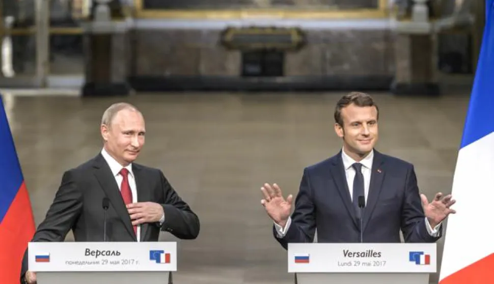 epa05997773 French President Emmanuel Macron (R) and Russian President Vladimir Putin (L) speak at a joint news conference after a working meeting at the Versailles Palace, near Paris, France, 29 May 2017. Discussions between the two are expected to include the situation in Syria and Russia's veto position at the UN security council. EPA/CHRISTOPHE PETIT TESSON