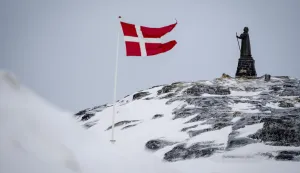 epa11953191 A view of the Dannebrog and Hans Egede Statue in Nuuk, Greenland, 09 March 2025 (issued 10 March 2025). Greenlanders are holding elections for Greenland's parliament, Inatsisartut, on 11 March 2025. EPA/Mads Claus Rasmussen DENMARK OUT