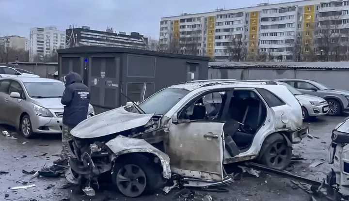 epa12608271 A handout still image taken from a video provided by the Russian Investigative Committee press service shows a Russian investigator working near a destroyed car following a blast from an explosive device planted under the vehicle in a residential area of Moscow, Russia, 22 December 2025. The head of the Russian General Staff's Operational Training Directorate, Lt. Gen. Fanil Sarvarov, was killed in a car explosion in Moscow, the Russian Investigative Committee reported. EPA/RUSSIAN INVESTIGATIVE COMMITTEE HANDOUT BEST QUALITY AVAILABLE HANDOUT EDITORIAL USE ONLY/NO SALES