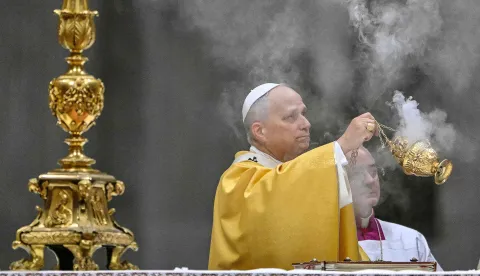 Pope Leo XIV holds an incent burner as he performs the Christmas Eve mass at St Peter's Basilica in the Vatican on December 24, 2025. (Photo by Andreas SOLARO/AFP)