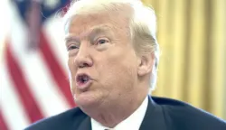 epa06403178 US President Donald J. Trump delivers remarks to members of the news media while signing a series of bills in the Oval Office of the White House in Washington, DC, USA, 22 December 2017. Trump signed the tax bill, a continuing resolution to fund the government, and a missile defense bill before leaving to spend Christmas in Mar-a-Lago, Florida. EPA/MICHAEL REYNOLDS