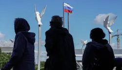 epa10206094 People stand in line during voting in a referendum on the joining of Russian-controlled regions of Ukraine to Russia, at an outdoor polling station in Mariupol, eastern Ukraine, 25 September 2022. From 23 to 27 September, residents of the self-proclaimed Luhansk and Donetsk People's Republics as well as the Russian-controlled areas of the Kherson and Zaporizhzhia regions of Ukraine vote in a referendum to join the Russian Federation. On 24 February 2022 Russian troops entered the Ukrainian territory in what the Russian president declared a 'Special Military Operation', starting an armed conflict that has provoked destruction and a humanitarian crisis. EPA/STRINGER