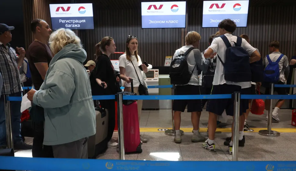 epa12242992 Passengers of Russian Nordwind Airlines queue in front of check-in desks at Sheremetyevo International Airport outside Moscow, Russia, 17 July 2025. According to the Russian Ministry of Transport, Nordwind Airlines will begin operating direct flights between Moscow and Pyongyang, North Korea on 27 July 2025. EPA/MAXIM SHIPENKOV