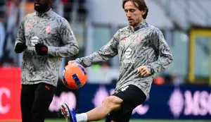 AC Milan's Croatian midfielder #14 Luka Modric warms up ahead of the Italian Serie A football match between AC Milan and Hellas Verona at the San Siro Stadium in Milan, northern Italy, on December 28, 2025. (Photo by Piero CRUCIATTI/AFP)