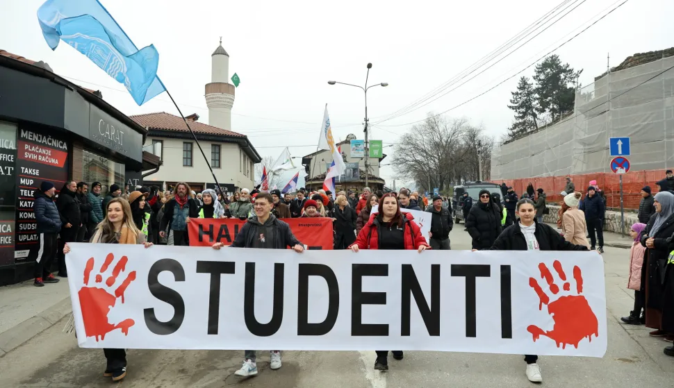epa12607095 Protestors hold a banner reading 'Students' during a demonstration organized by university students in front of the State University of Novi Pazar (DUNP) building in Novi Pazar, Serbia, 21 December 2025. Students from across Serbia joined local demonstrators to protest alleged systemic injustice following the reported loss of student status for more than 200 DUNP students and the dismissal of 30 professors at the institution. Participants also held a memorial service to honor the victims of the Novi Sad railway station canopy collapse that occurred in 2024. EPA/DJORDJE SAVIC